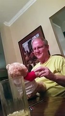 This man was happy when he received a teddy bear as a gift from his son