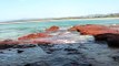 Water Flowing Over The Rocks Into The Rock Pond