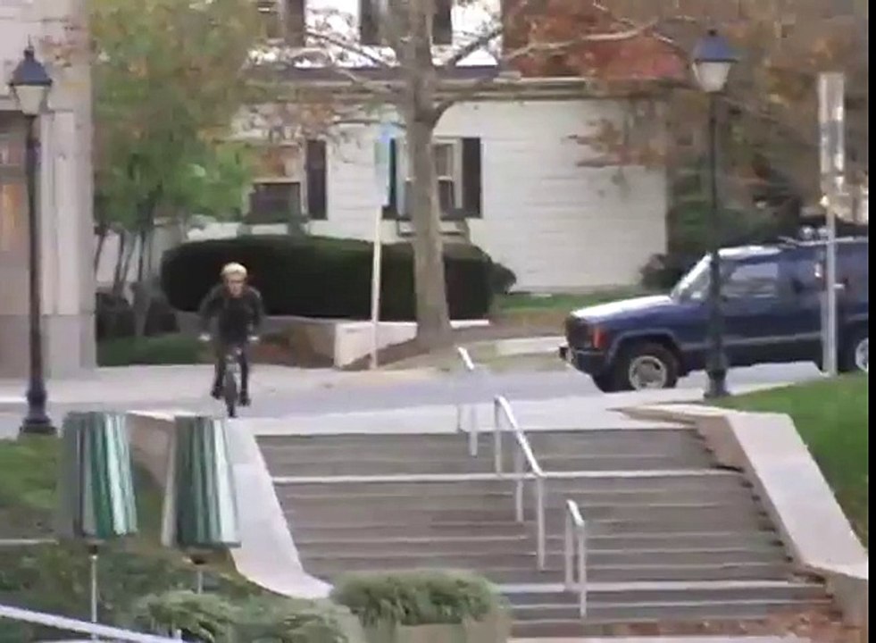 BMX crash white car