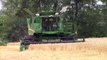 John Deere S660 Combine Harvesting Wheat In the Rain