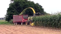 Two John Deere 7780 Pro Drive Forage Harvesters Opening a Corn Field