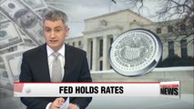 Fed keeps interest rates unchanged citing slower growth