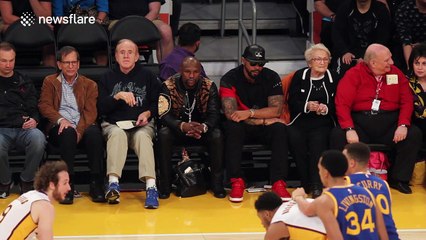 Rihanna watching the LA Lakers courtside at the Staples Center