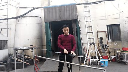 Martial artist climbs stairs and skips on his head