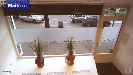 Woman Driver Careers into Shop Window