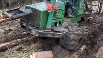 John Deere 810D stuck in deep mud, tractor T 40AM trying to help