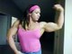 world fitness Big Strong Muscle Woman flexing her biceps in webcam