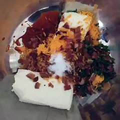 Spicy cream cheese ball covered in bacon and sriracha chips.