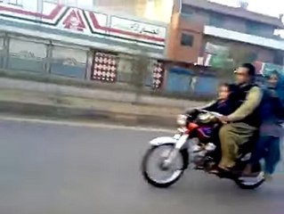 Boy wheeling on Bike with his Girl Friend