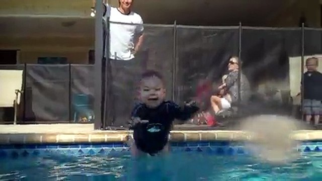 Talented baby jumps in and swims across pool