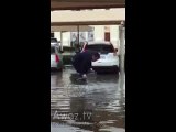 Desperate Man Trapped in Shopping Cart During Extreme Rain in Abu Dhabi