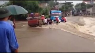 The passenger bus was swept away when flood