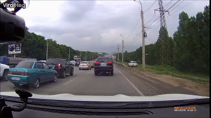 A Russian driver decides to bypass the traffic jam by taking the ditch.