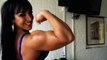 world fitness Big muscle woman flexing her powerful 16 inch biceps