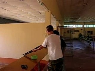 Ryan shooting a shotgun
