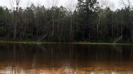 Sprinklers keep working on flooded field