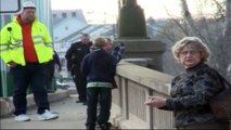 Does he jump? Cops close bridge as man contemplates suicide.