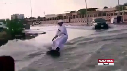 Heavy rains hit UAE roads enterprising young man showed surfing