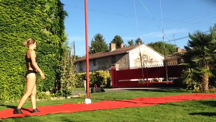 Woman Performs Handstand on Swing