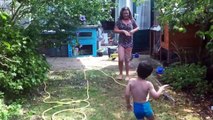 Playing with Irrigation sprinkler in the garden / Water pret met sproeier