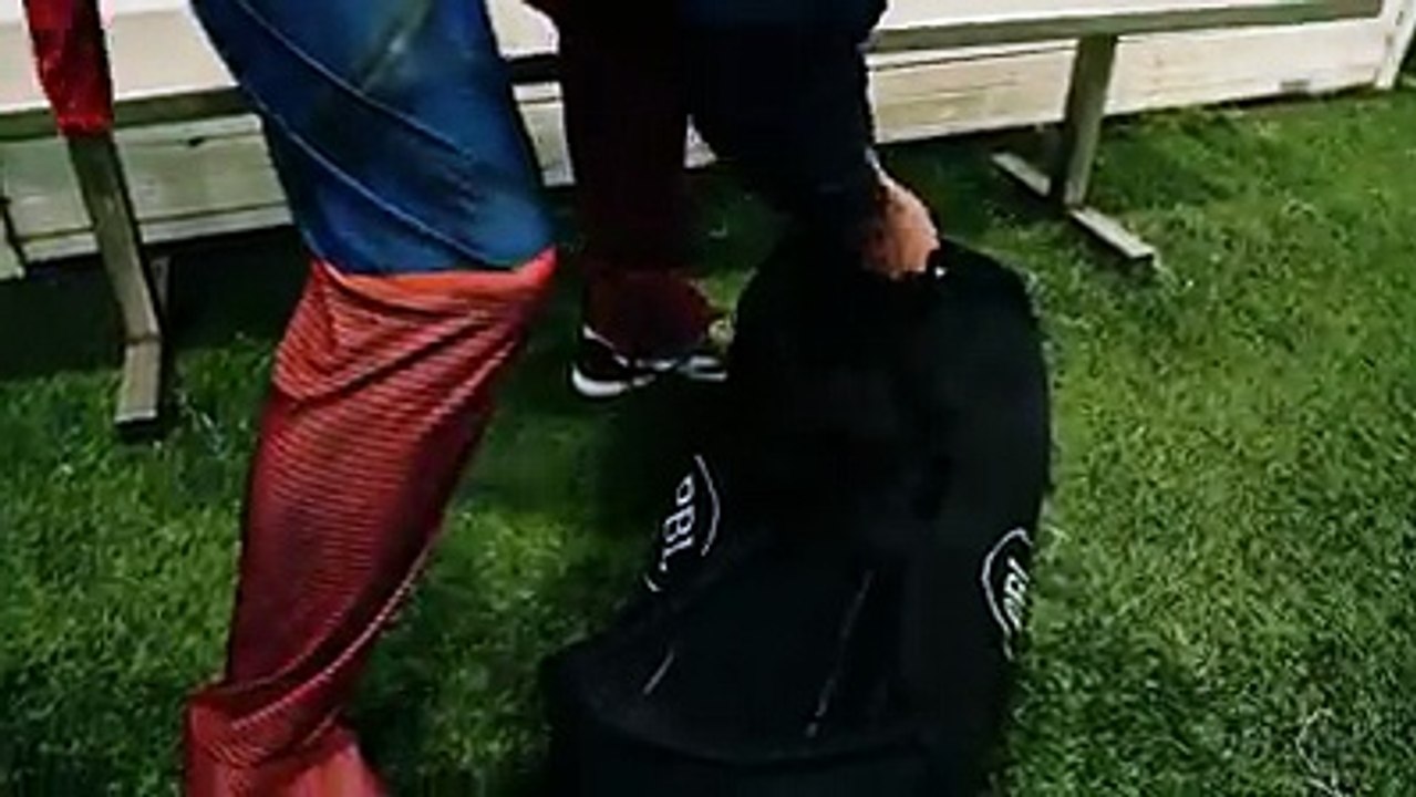 People wearing cosplay play Football