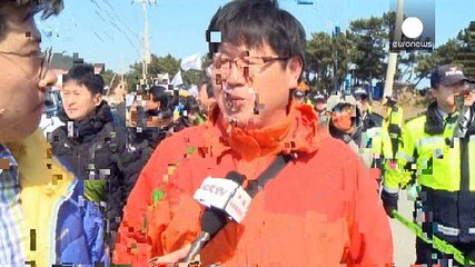 Protest against US-S.Korea war games as Pyongyang 'seeks missing submarine'