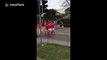 These Welsh rugby players set up a line-out on a busy road ahead of England v Wales