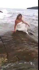 Model gets swept away by waves
