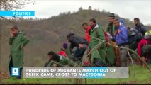 Hundreds of migrants march out of Greek camp, cross to Macedonia