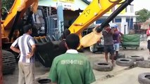 Amazing Loading Excavator on Busy Road in East Timor