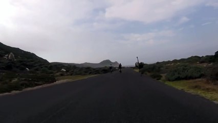 Cyclists chased by an ostrich