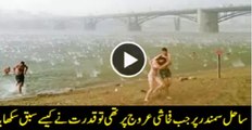 Siberian beach-goers hit by hail-storm Watch Video