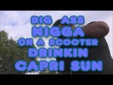 BIG BUFF BLACK MAYNE ON A SCOOTER DRINKIN CAPRI SUN!