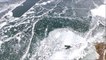 Dramatic drone footage of islands in semi-frozen lake