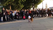 Tourist girl is challenged by street performers in central London