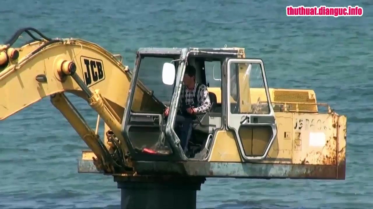 Excavator in sea