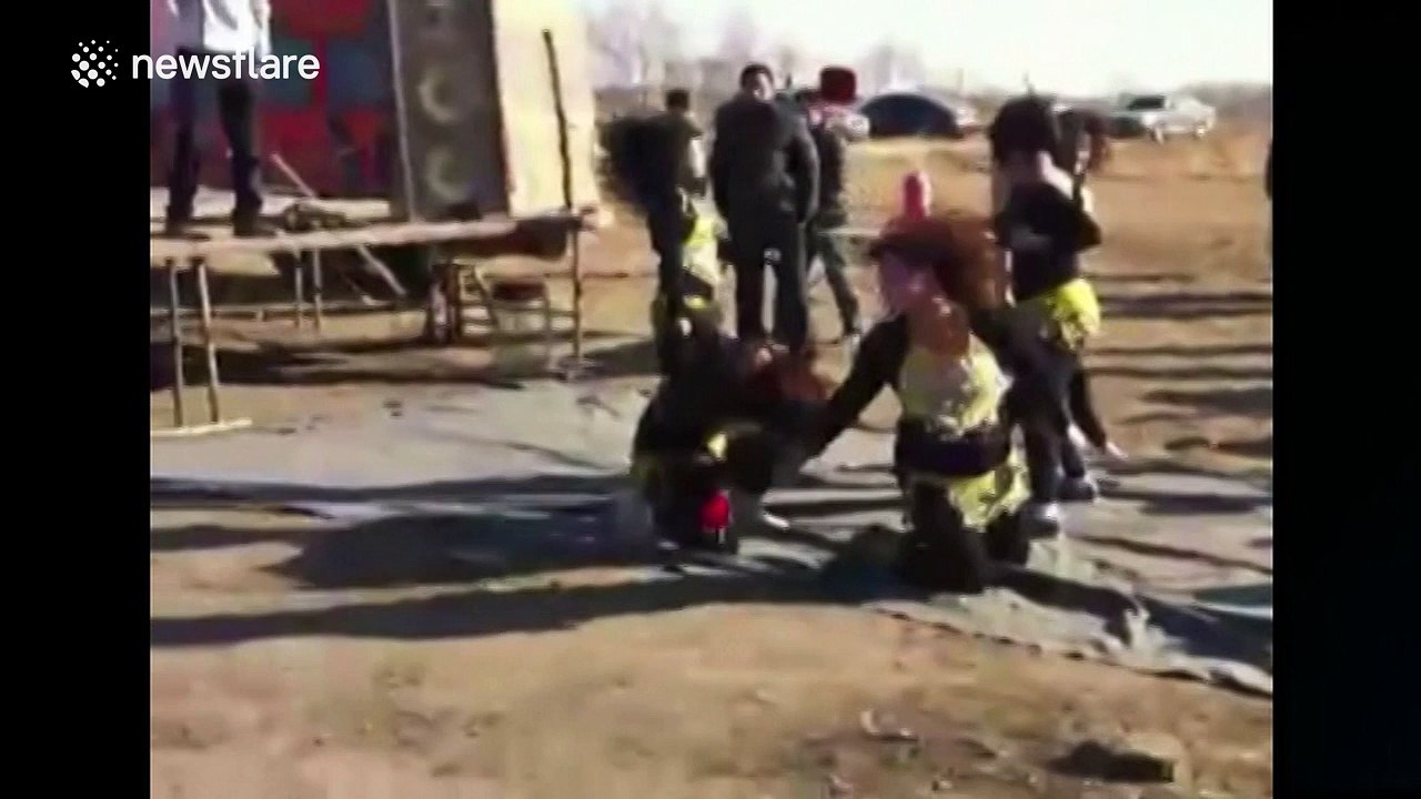 Country artists perform ridiculous headbanging dance to trance music