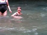 Jean enjoys swim in river at Corcovado National Park, Costa Rica