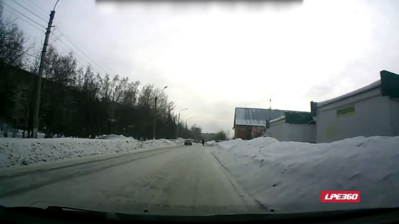 Jeep flips on icy road after hitting snow bank - dash cam