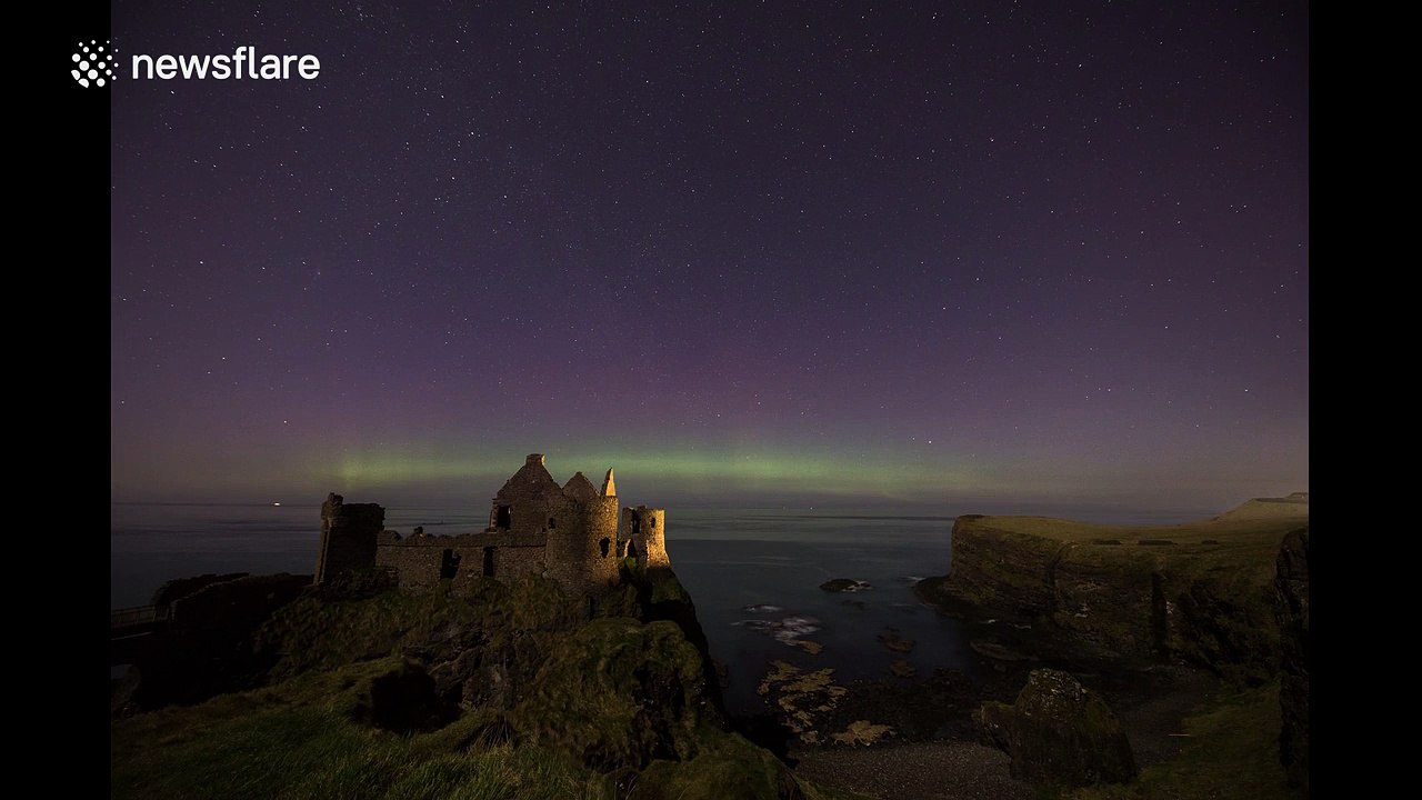 St Patricks Day Northern Lights above Irish castle