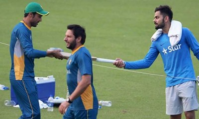 Virat Kohli gifts Mohd Amir bat in fresh show of love