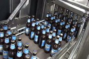 Shrink Wrapping Glass Bottles of Beer