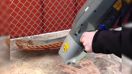 Laser device works to remove rust from iron quickly and accurately high