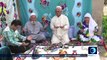 Tajiks set Haft Seen tablecloth during Nowruz