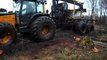 Valtra forestry tractor stuck in mud, difficult conditions in wet forest