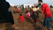 Syrian Children playing Duck Duck Goose in Arabic in Syrian Refugee Camp