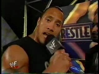 The Rock Rips shirt like Hogan in interview with coach