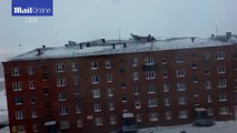 The shocking moment windstorm rips off metal roof from building