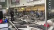 Debris litters the floor of Brussels airport after two explosions hit the building