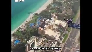 man jumps to big bulding in air